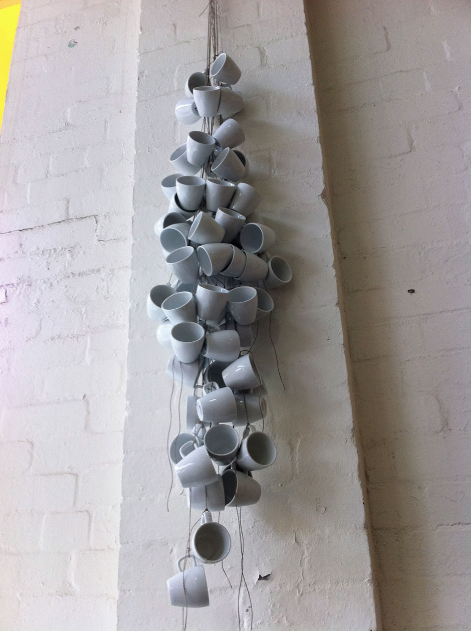 The barnacle artwork includes around 60 espresso cups. The feel and quality and form of the china espresso cups suggests similarities with sea shells.